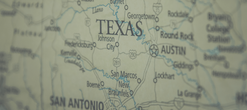 close up of printed map of texas, focused on the state's name