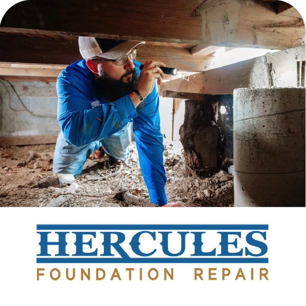 Hercules Foundation Repair worker with flashlight inspects pier and beam foundation under a house